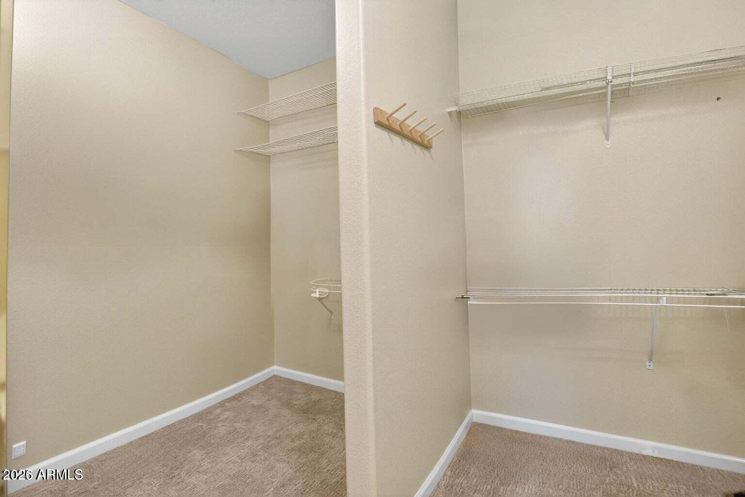 8245 East Bell Road, Unit 121 Scottsdale, AZ 85260 - Photo 15 of 22 a view of an empty walk in closet
