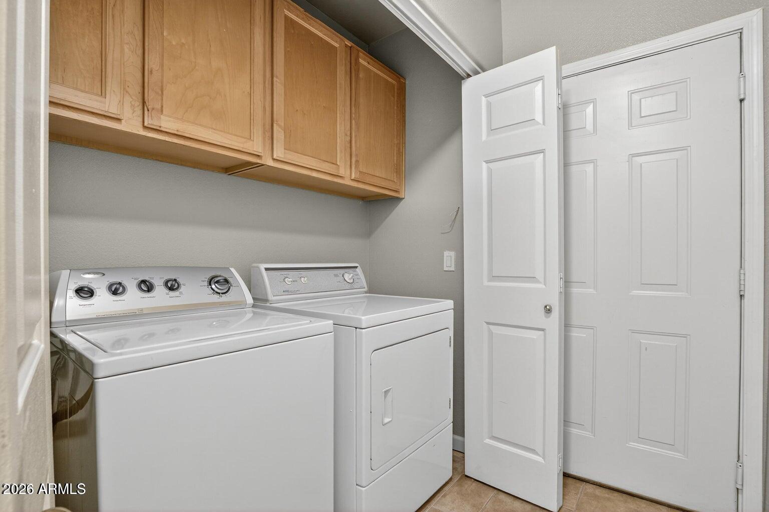 8245 East Bell Road, Unit 121 Scottsdale, AZ 85260 - Photo 18 of 22 a utility room with dryer and washer