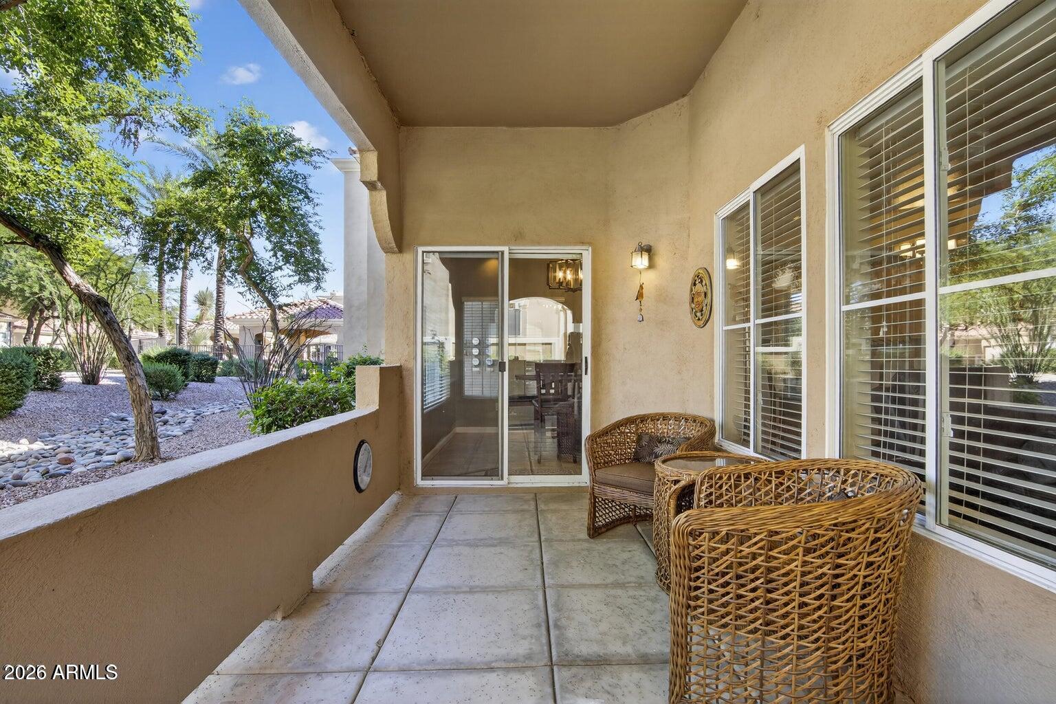 8245 East Bell Road, Unit 121 Scottsdale, AZ 85260 - Photo 19 of 22 a living room with furniture and a potted plant