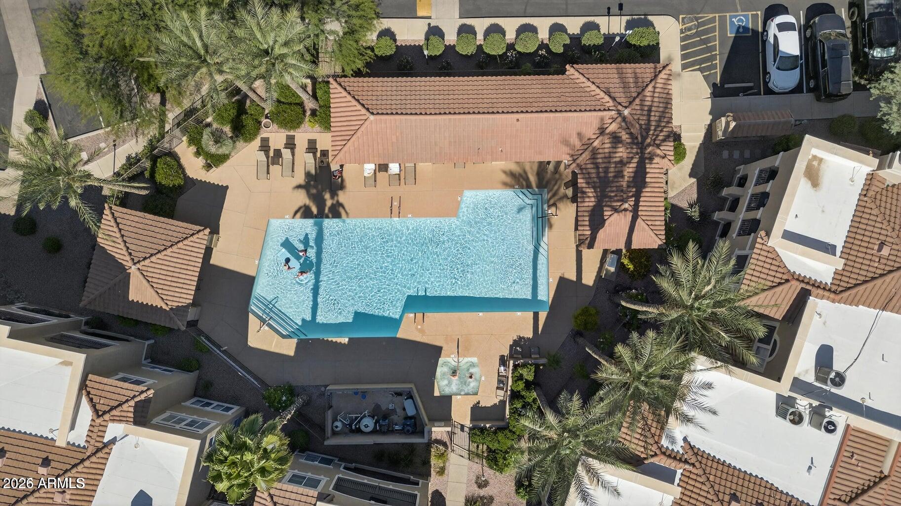 8245 East Bell Road, Unit 121 Scottsdale, AZ 85260 - Photo 21 of 22 an aerial view of a house with a yard