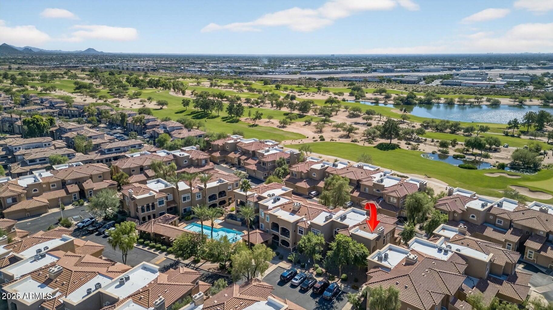 8245 East Bell Road, Unit 121 Scottsdale, AZ 85260 - Photo 22 of 22 an aerial view of residential building and lake