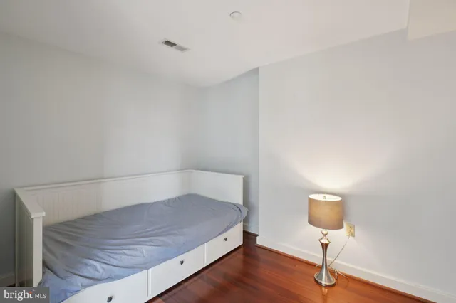 a view of room with wooden floor