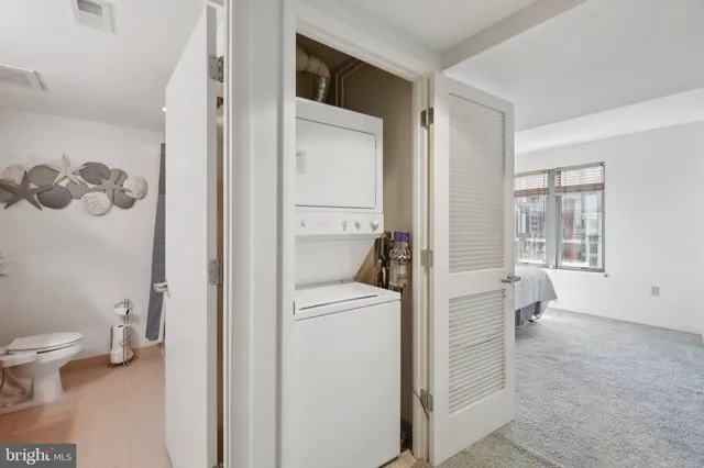a view of bathroom with a toilet sink and a window