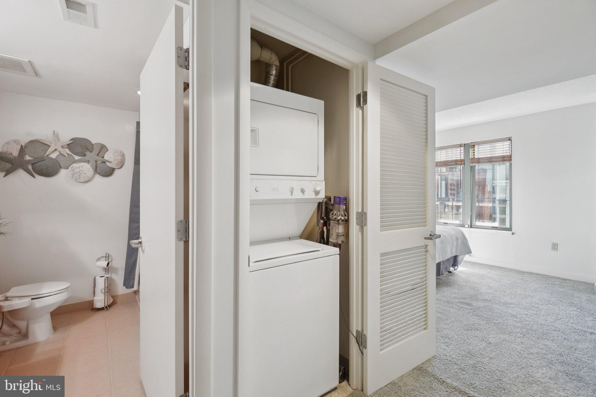 1150 K Street Northwest, Unit 1111 Washington, DC 20005 - Photo 16 of 36 a view of bathroom with a toilet sink and a window
