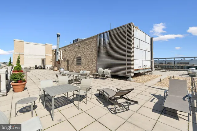 a view of a terrace with furniture and stove