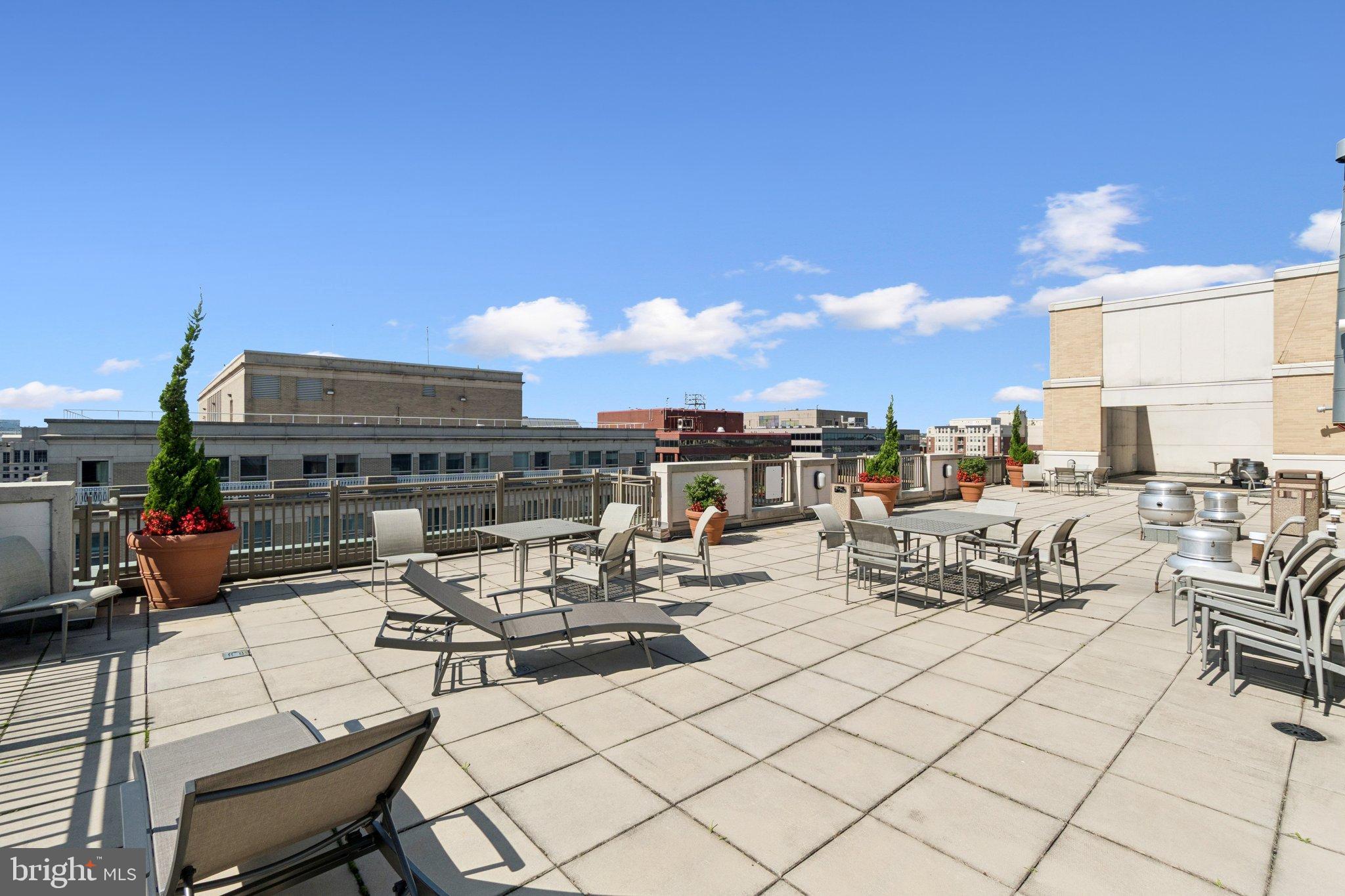 1150 K Street Northwest, Unit 1111 Washington, DC 20005 - Photo 32 of 36 a view of a terrace with furniture and stove