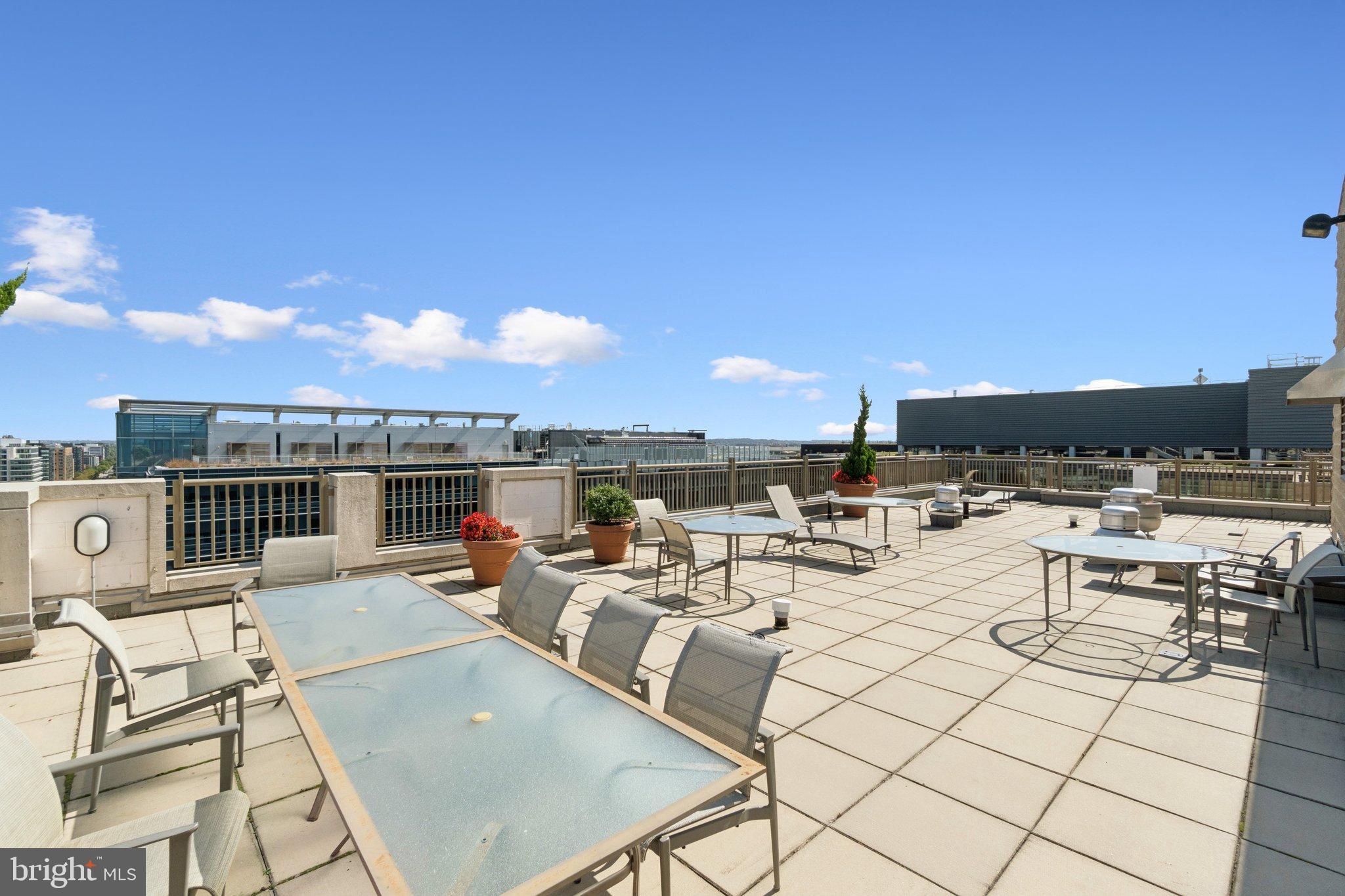 1150 K Street Northwest, Unit 1111 Washington, DC 20005 - Photo 34 of 36 a view of a terrace with furniture and a fire pit