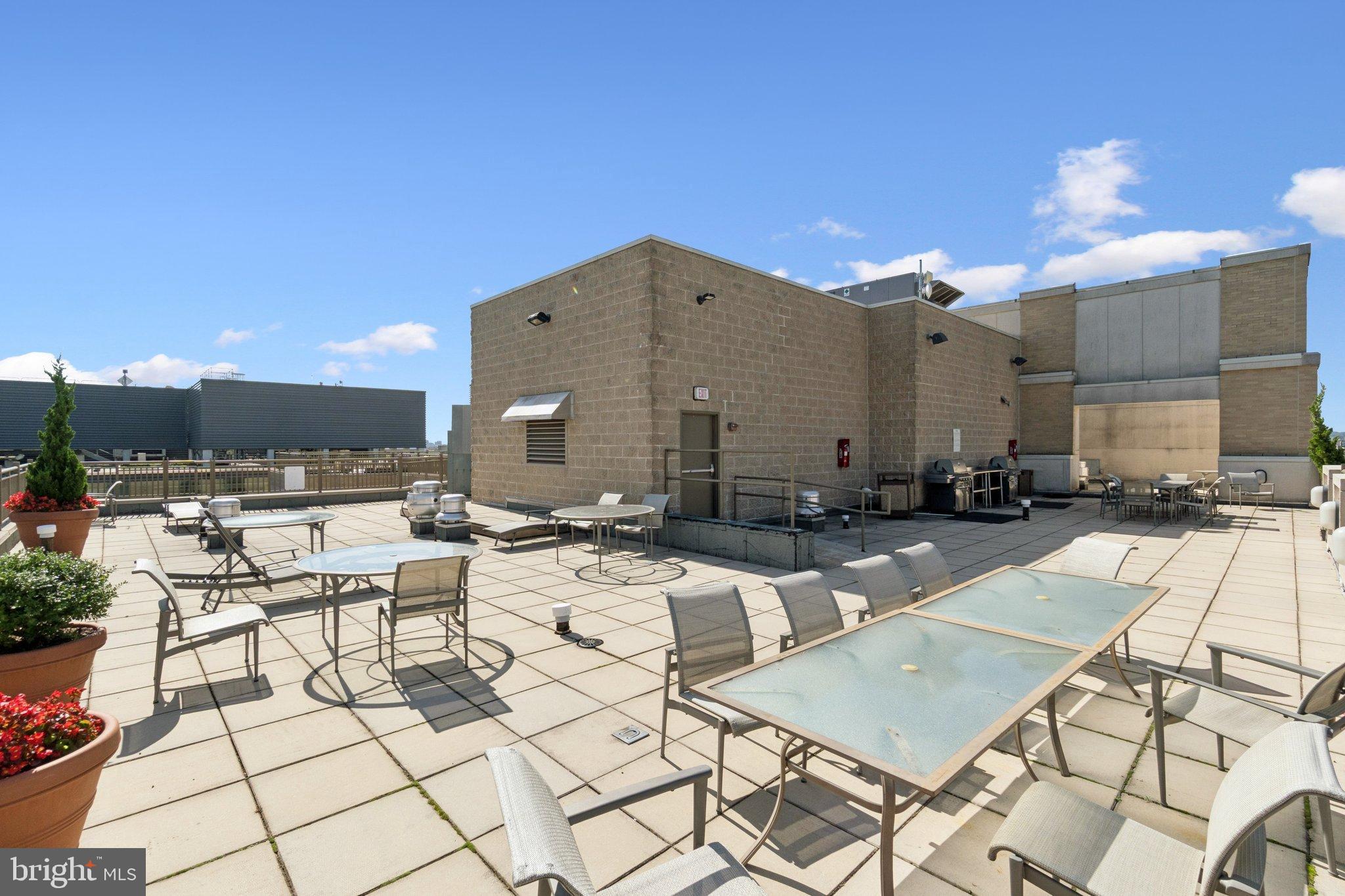 1150 K Street Northwest, Unit 1111 Washington, DC 20005 - Photo 35 of 36 a view of outdoor kitchen with seating area
