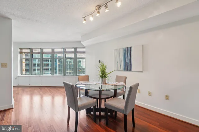 a view of a dining room with furniture window and wooden floor