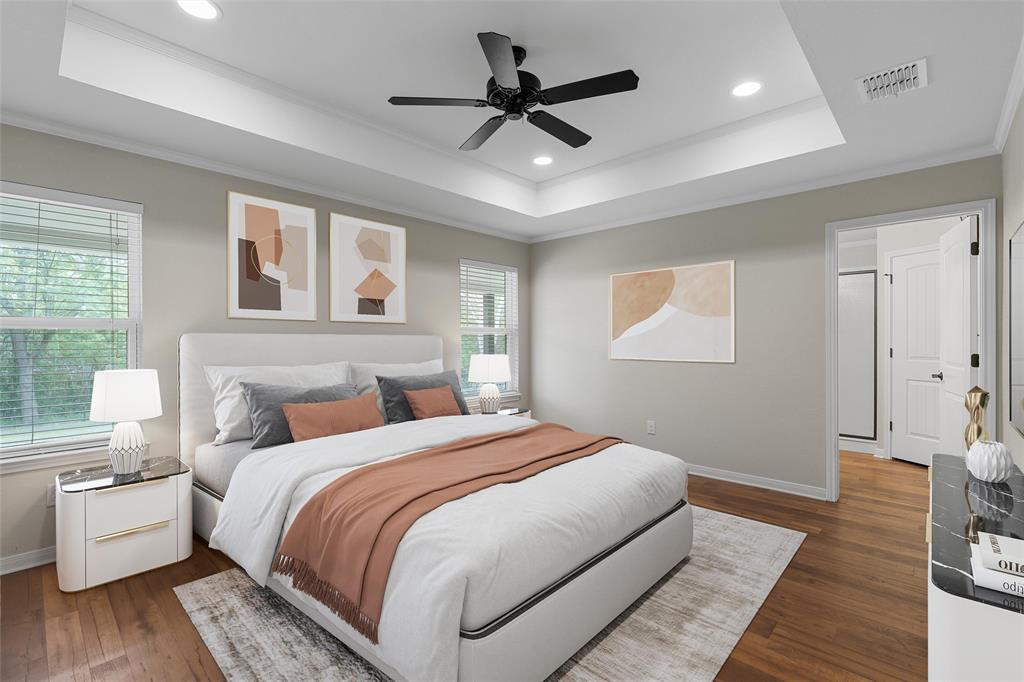 8224 Forest Ridge Drive Woodway, TX 76712 - Photo 18 of 38 a bedroom with a bed and a chandelier