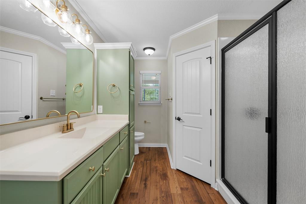 8224 Forest Ridge Drive Woodway, TX 76712 - Photo 19 of 38 a bathroom with a double vanity sink and mirror