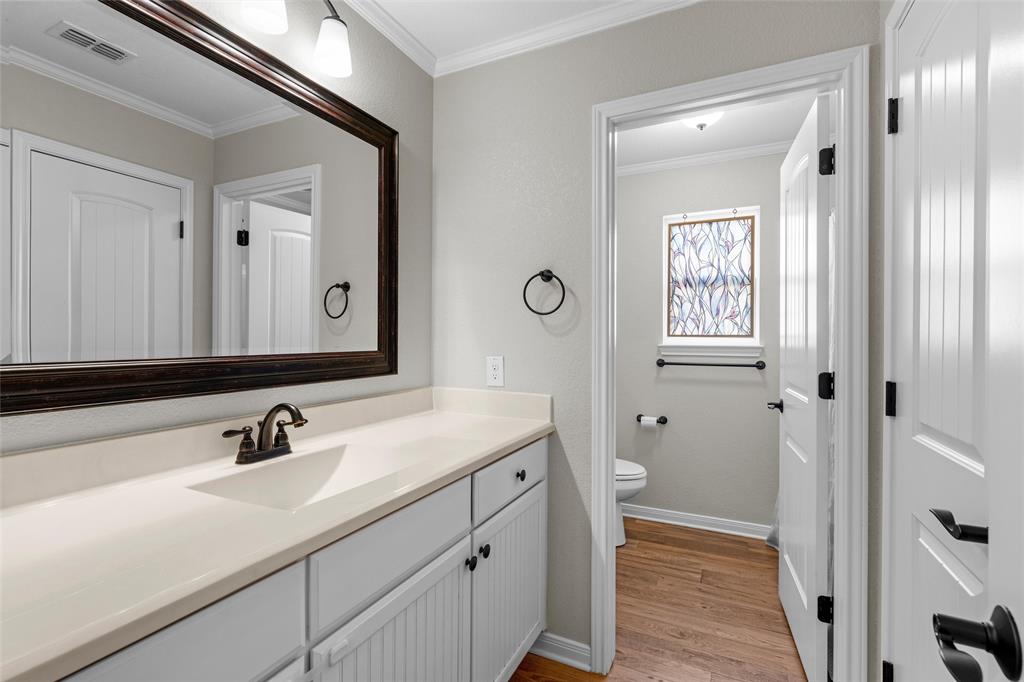 8224 Forest Ridge Drive Woodway, TX 76712 - Photo 23 of 38 a bathroom with a sink and a mirror