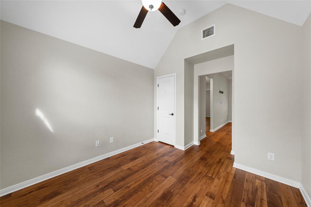 8224 Forest Ridge Drive Woodway, TX 76712 - Photo 24 of 38 a view of room with wooden floor and ceiling fan