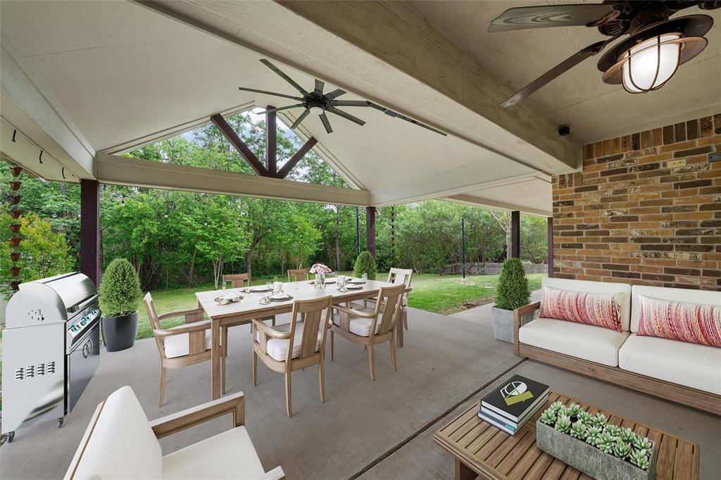 8224 Forest Ridge Drive Woodway, TX 76712 - Photo 28 of 38 a view of a patio with a dining table and chairs