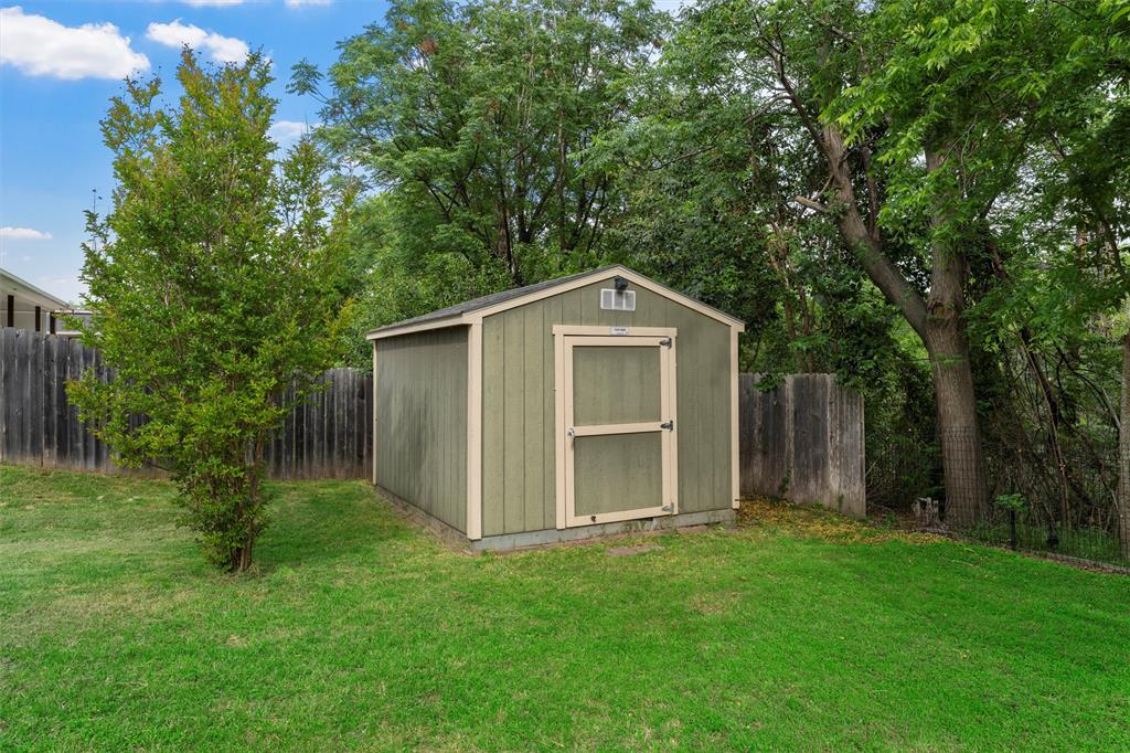 8224 Forest Ridge Drive Woodway, TX 76712 - Photo 34 of 38 a front view of house with yard and trees