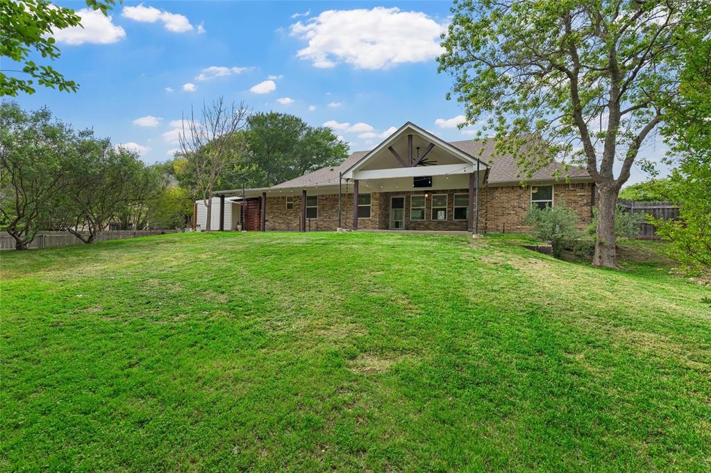8224 Forest Ridge Drive Woodway, TX 76712 - Photo 35 of 38 a front view of a house with garden