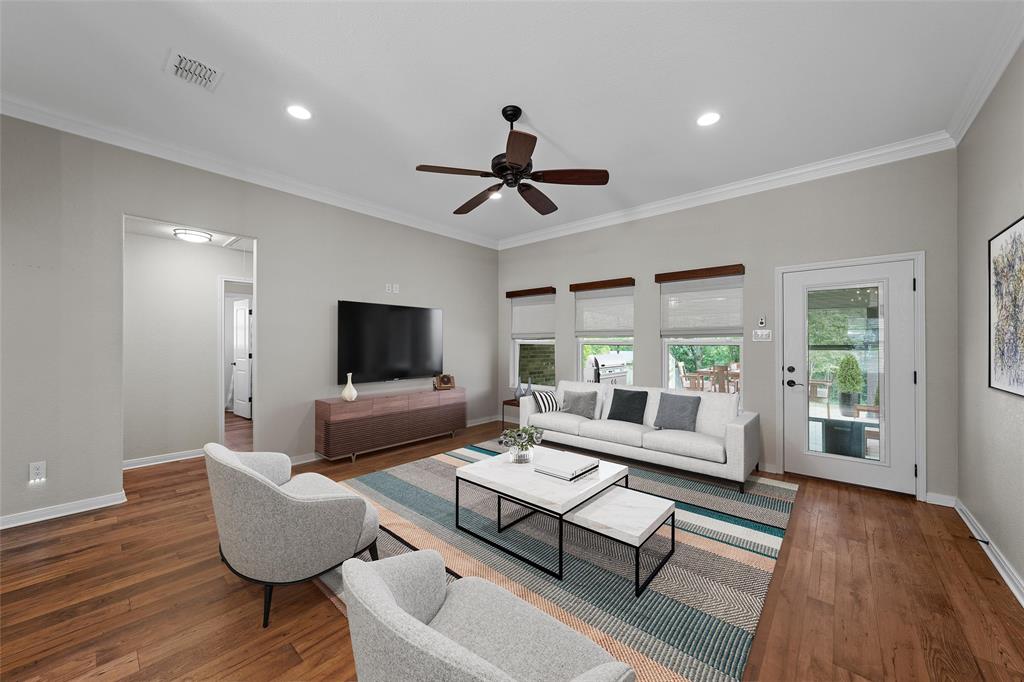8224 Forest Ridge Drive Woodway, TX 76712 - Photo 6 of 38 a living room with furniture and a flat screen tv