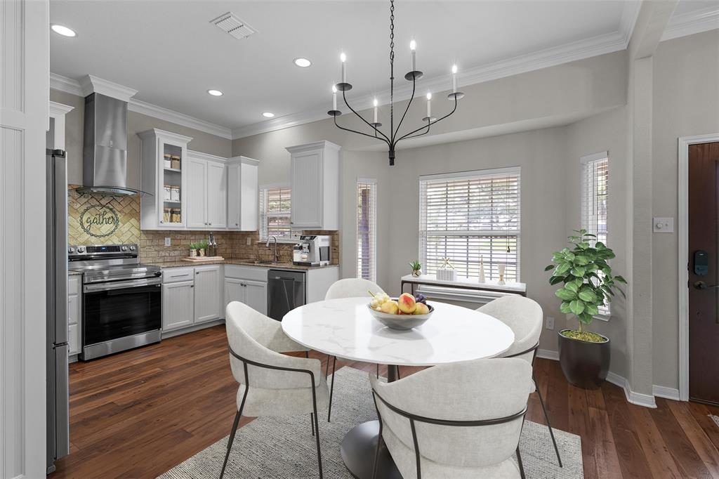 8224 Forest Ridge Drive Woodway, TX 76712 - Photo 9 of 38 a kitchen with a table and chairs in it