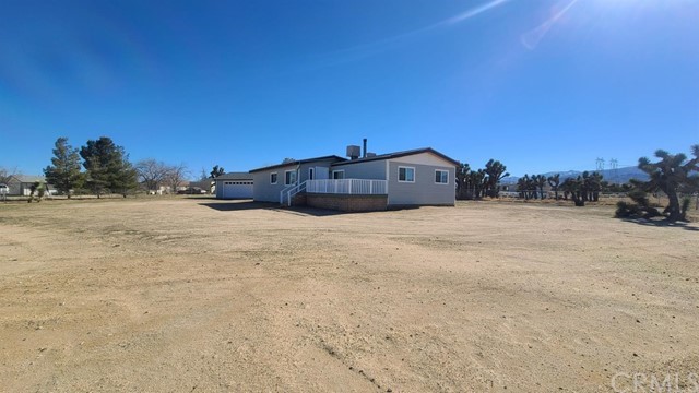 5949 Coyote Road Phelan, CA 92371 - Photo 1 of 1 a view of large house with a yard