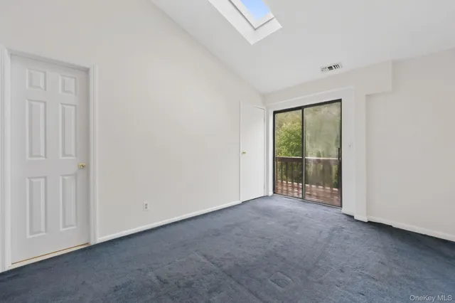a view of a livingroom with furniture and a flat screen tv