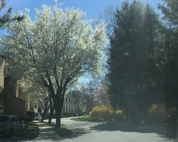 a view of a kitchen with kitchen island and a sink