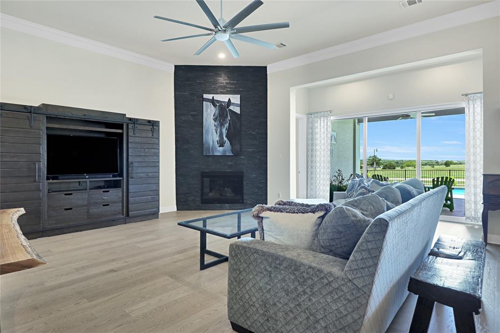1809 Shade Tree Street Fort Worth, TX 76008 - Photo 3 of 28 Living Room with gas fireplace and beautiful glass doors that open to the back patio