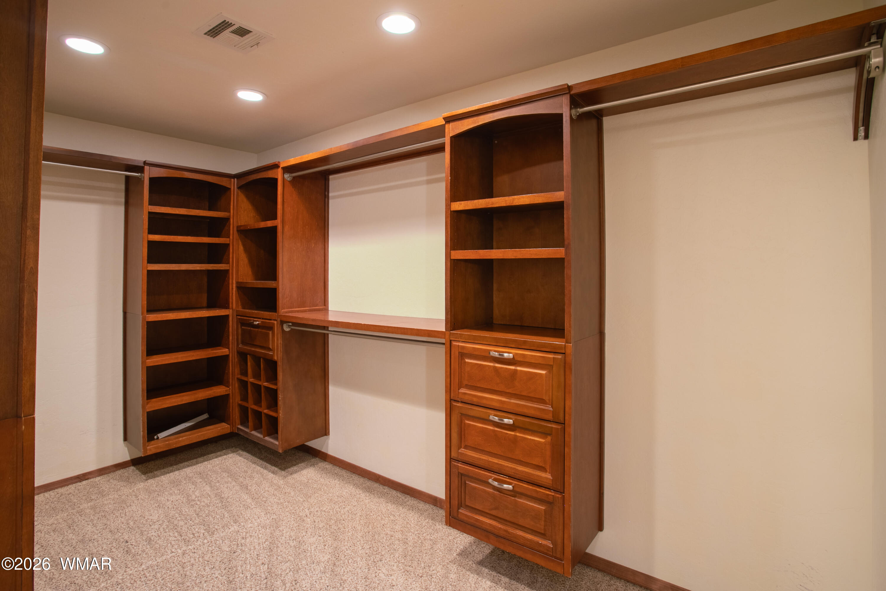 411 West Stratton Show Low, AZ 85901 - Photo 15 of 47 a view of walk in closet with empty racks
