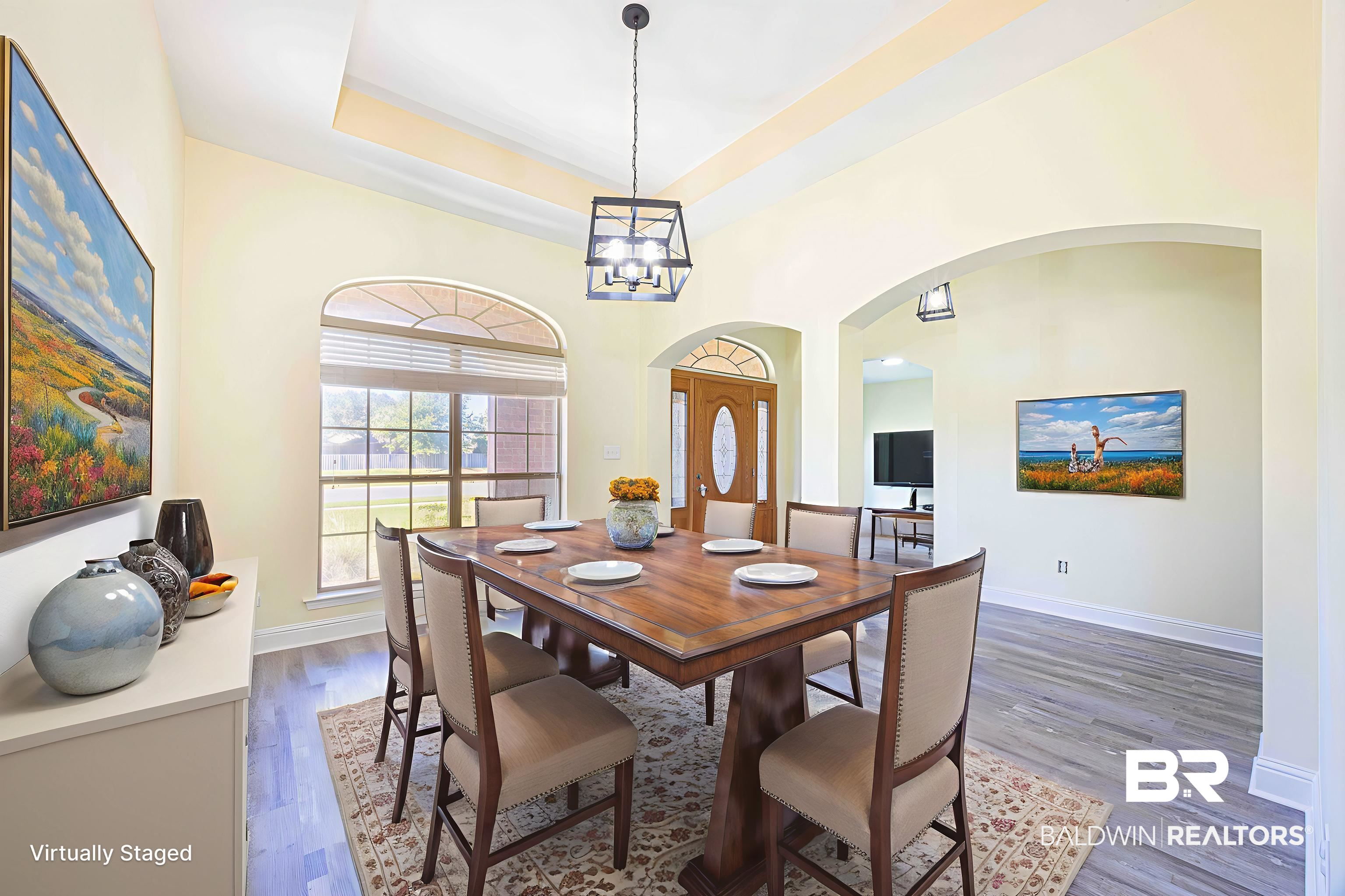 25234 Fairfax Road Daphne, AL 36526 - Photo 12 of 45 Dining area with arched walkways, dark wood finished floors, a tray ceiling, and a chandelier