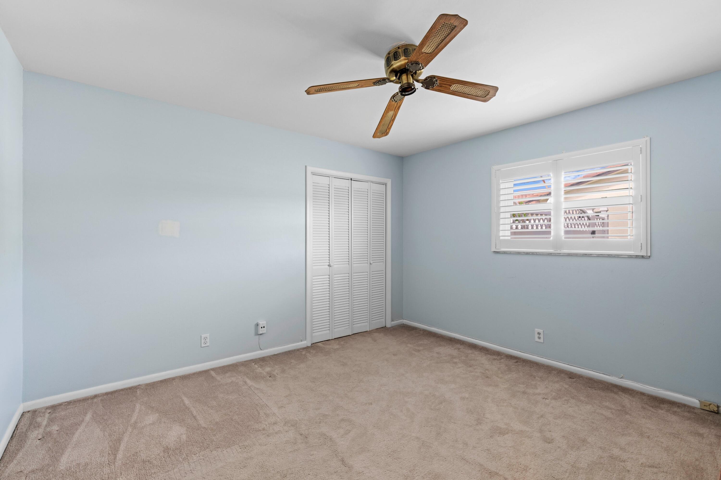 1640 Northwest 10th Street Boca Raton, FL 33486 - Photo 14 of 40 a view of room with ceiling fan and window