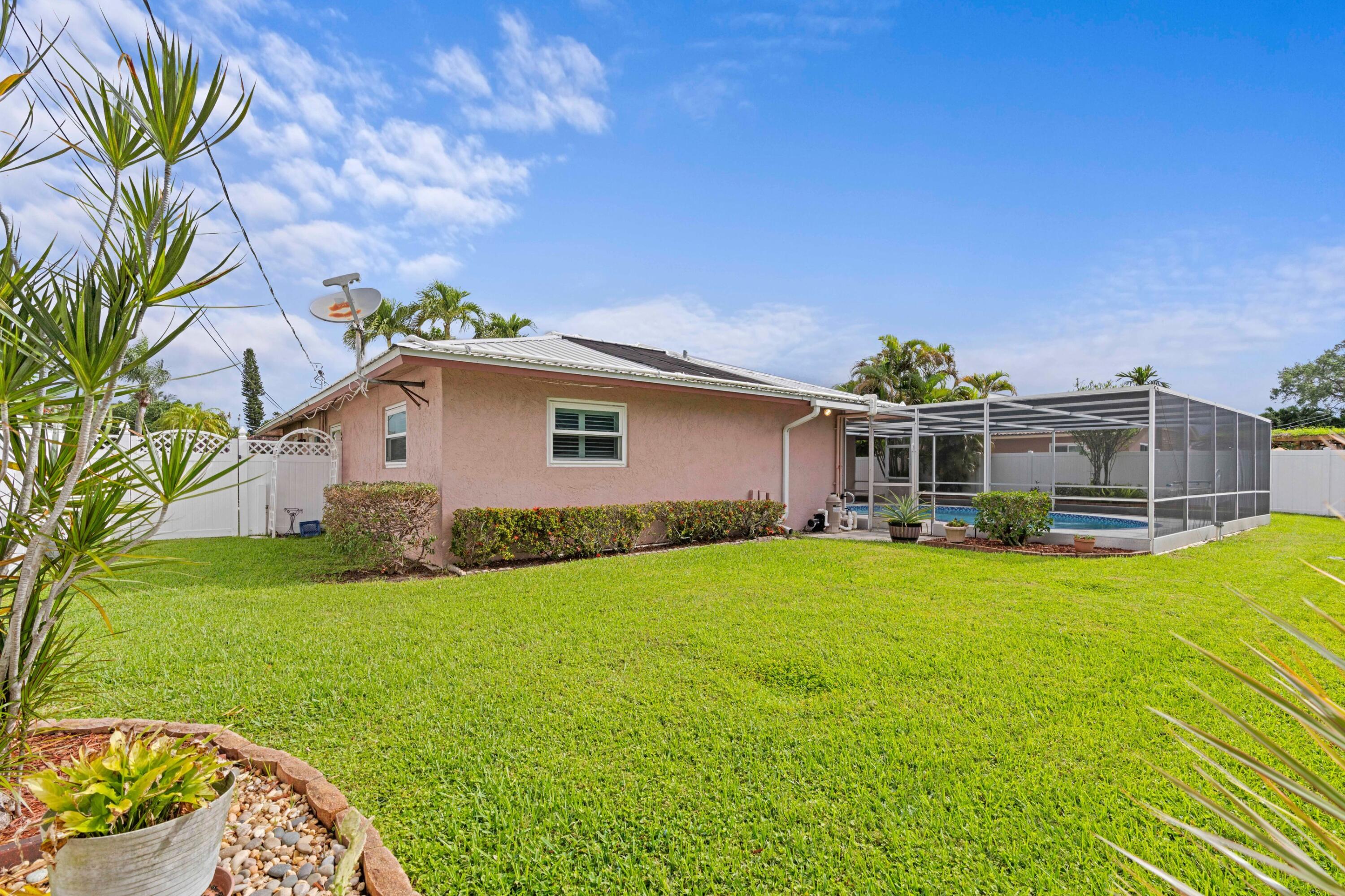 1640 Northwest 10th Street Boca Raton, FL 33486 - Photo 20 of 40 a view of a house with a yard