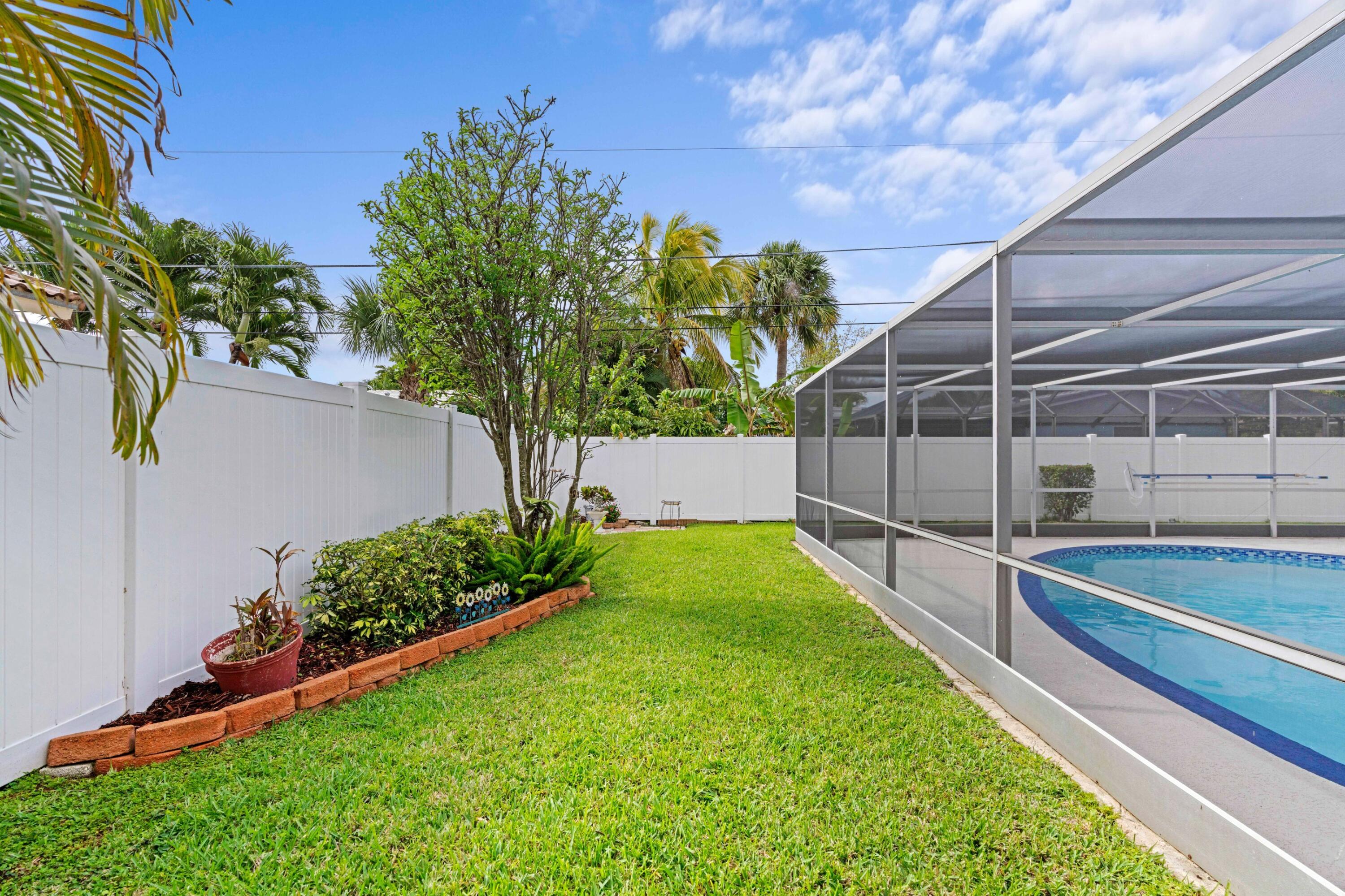 1640 Northwest 10th Street Boca Raton, FL 33486 - Photo 22 of 40 a view of yard with outdoor area