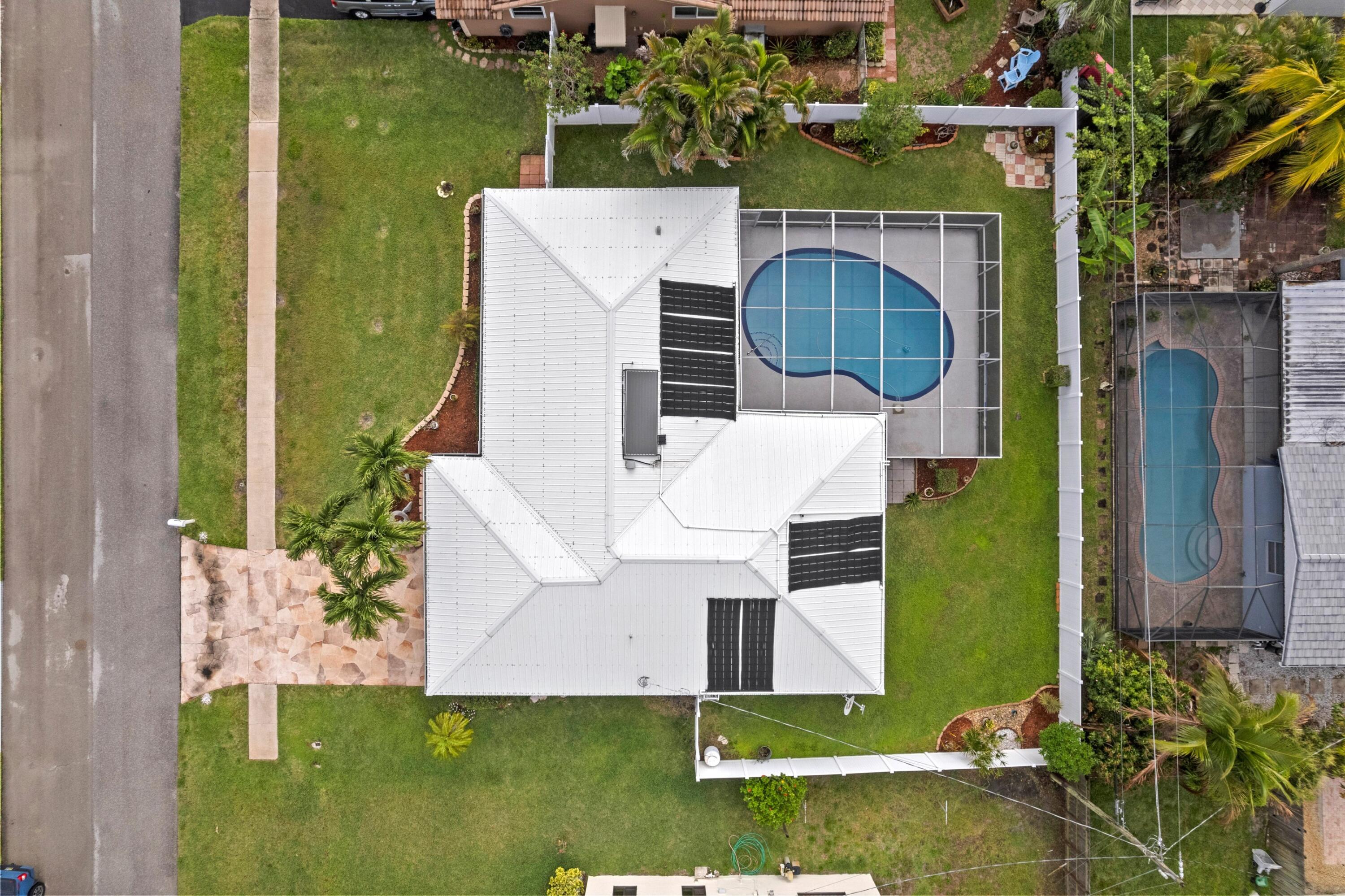 1640 Northwest 10th Street Boca Raton, FL 33486 - Photo 23 of 40 an aerial view of a house with a yard basket ball court and outdoor seating