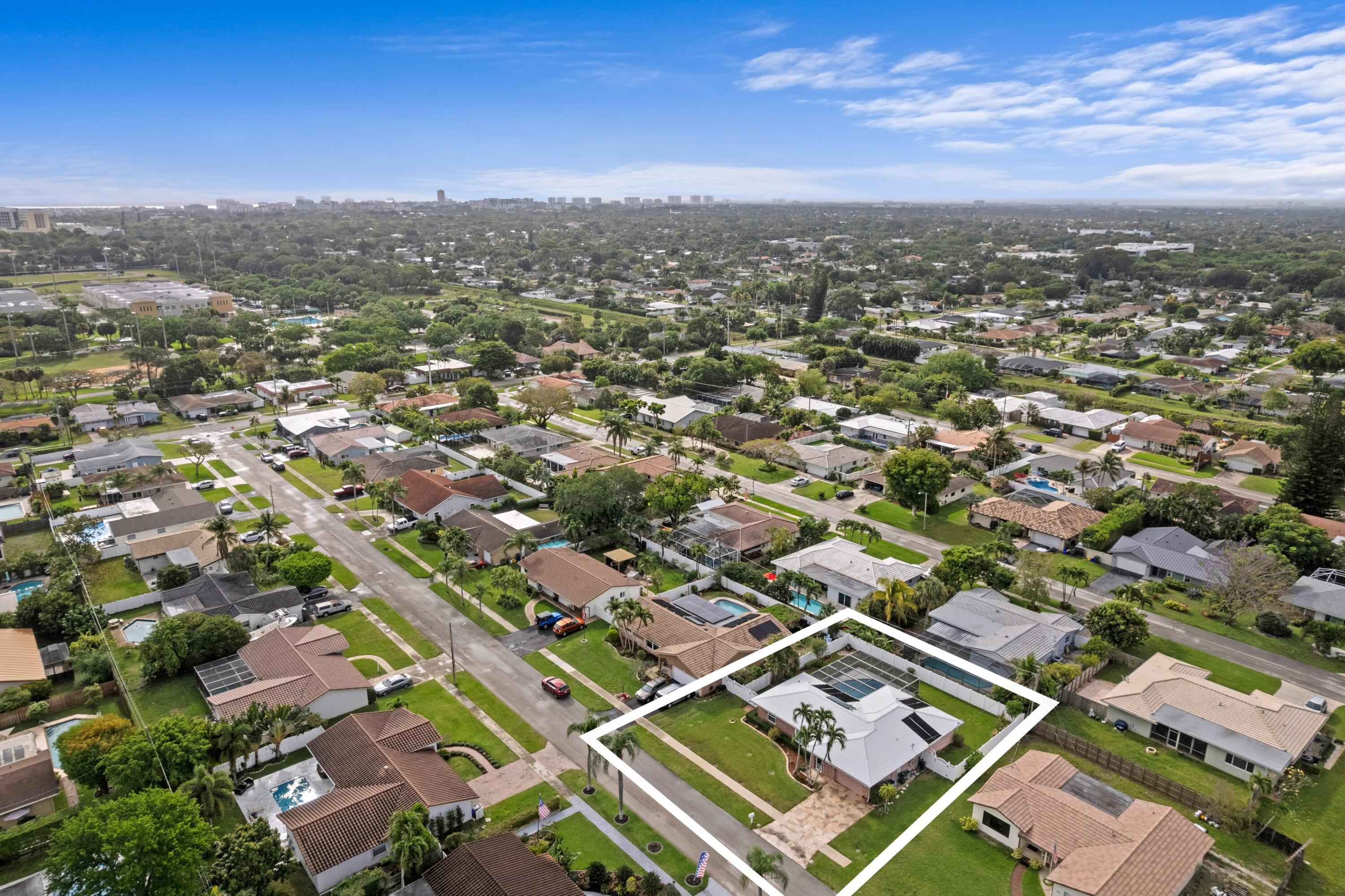 1640 Northwest 10th Street Boca Raton, FL 33486 - Photo 3 of 40 an aerial view of residential building with parking