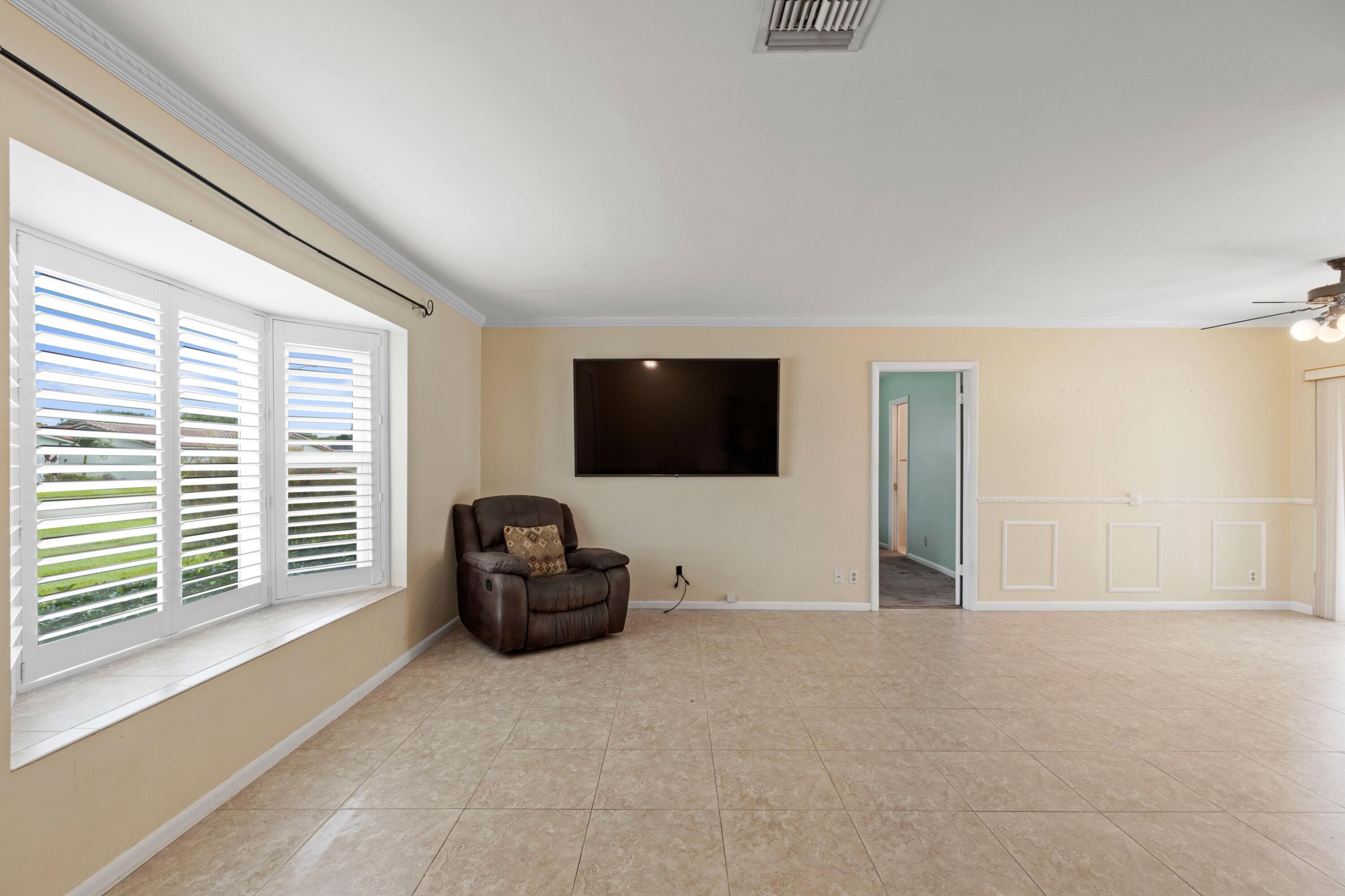 1640 Northwest 10th Street Boca Raton, FL 33486 - Photo 4 of 40 a livingroom with furniture and a window