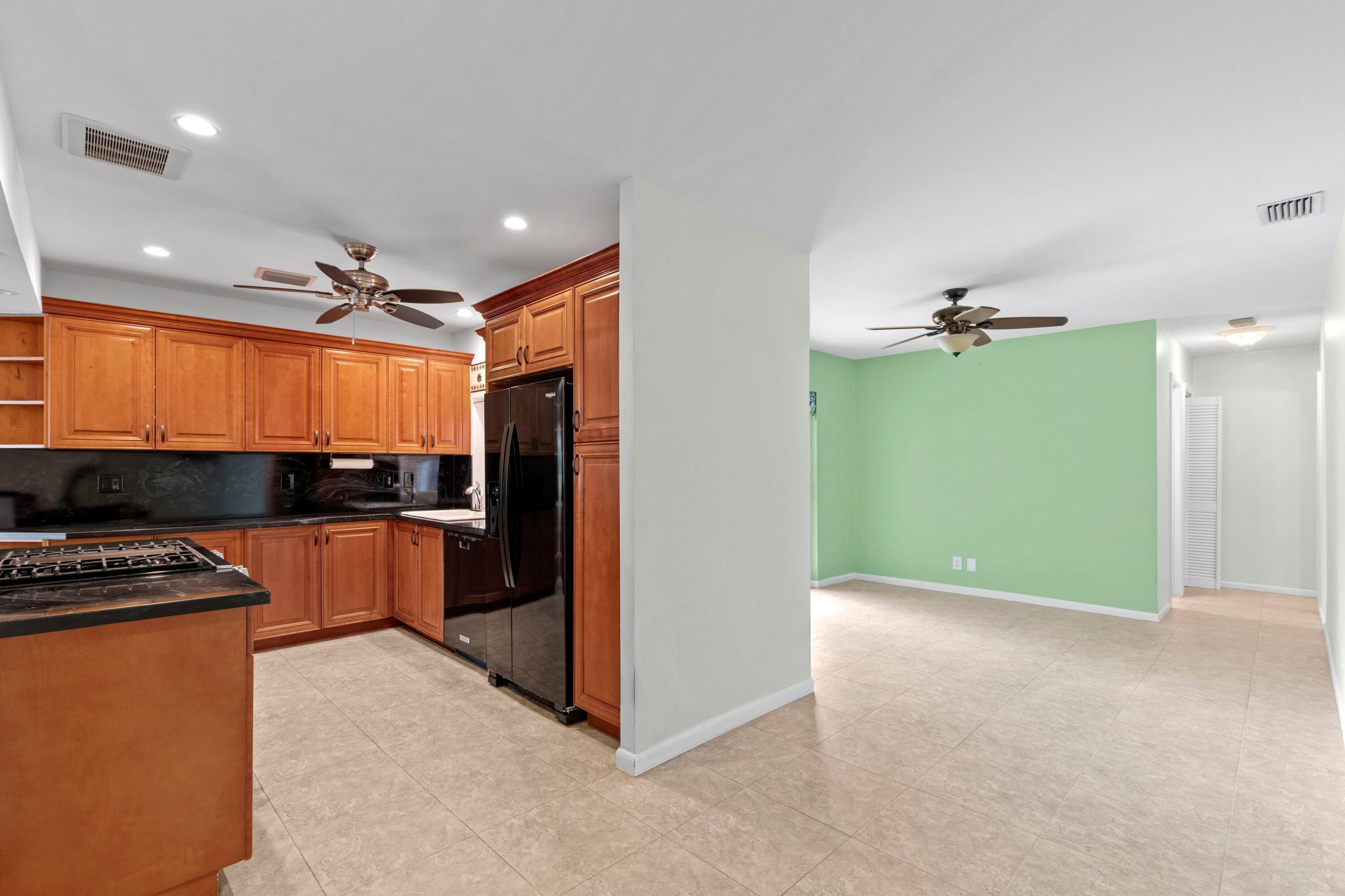 1640 Northwest 10th Street Boca Raton, FL 33486 - Photo 9 of 40 a view of kitchen and refrigerator