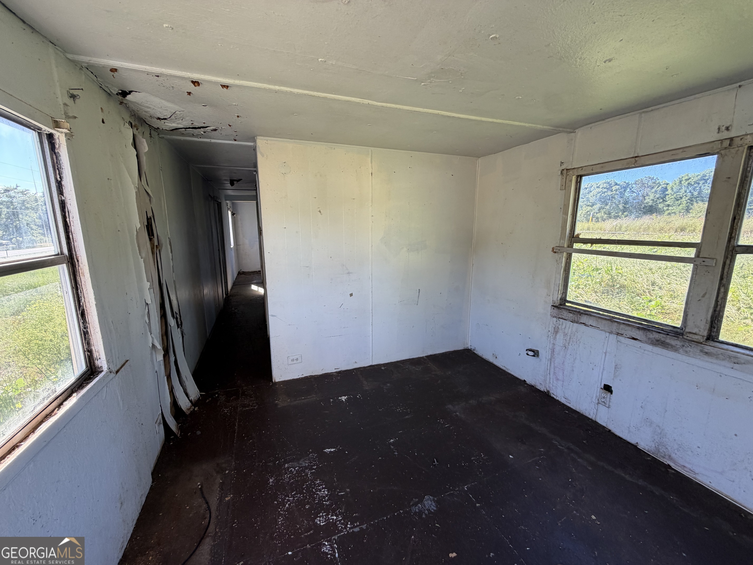 265 Aldora Street Barnesville, GA 30204 - Photo 8 of 9 a view of an empty room with a window