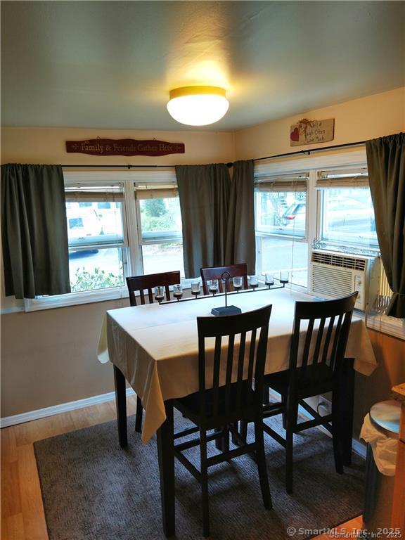 146 Pocono Point Road Danbury, CT 06811 - Photo 5 of 10 a view of a a dining room with furniture window and outside view