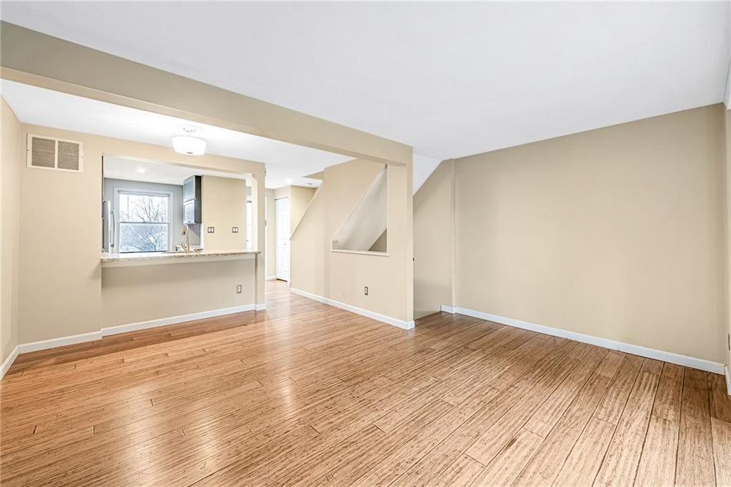 314 Quail Run Road Venetia, PA 15367 - Photo 4 of 24 an empty room with wooden floor and windows