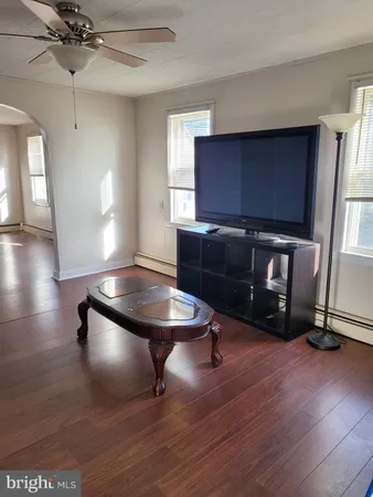a room with furniture and wooden floor