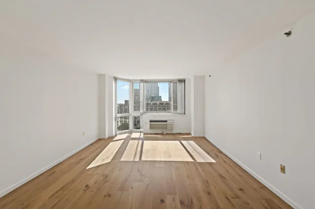 a view of wooden floor in a kitchen