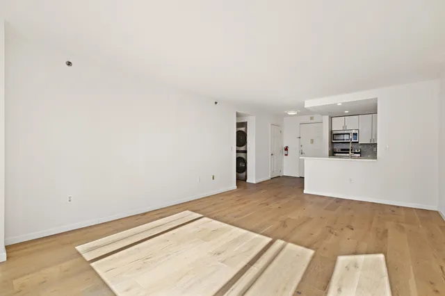 a view of a room with a sink and refrigerator