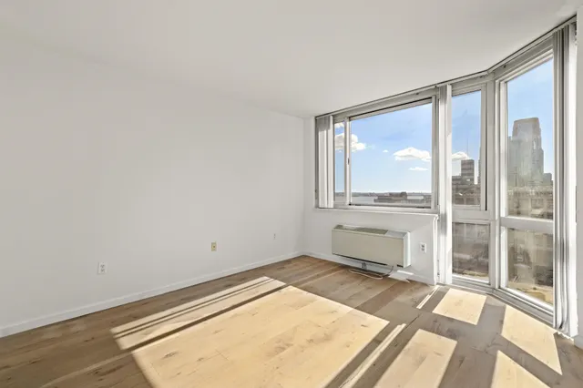 an empty room with large window