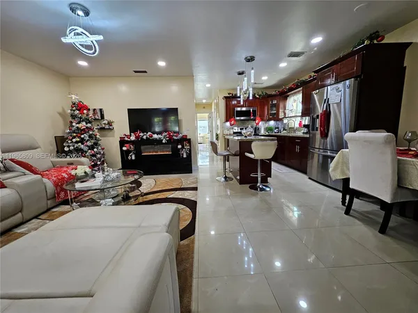 a room with furniture and a flat screen tv
