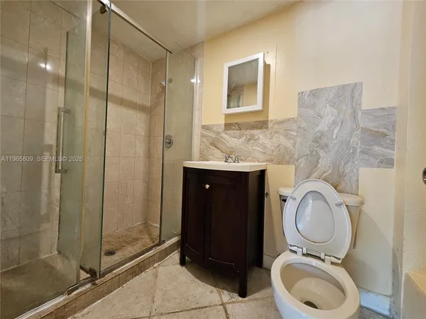 a bathroom with a toilet and a sink