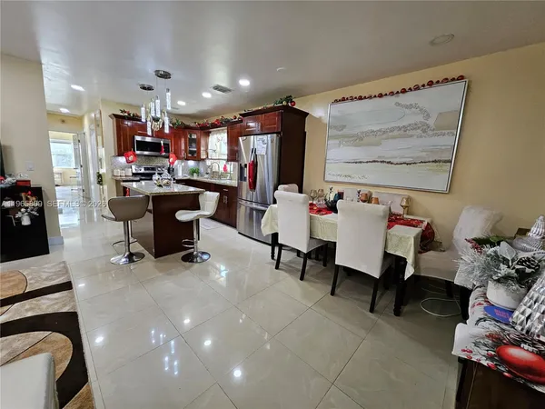 a room with furniture and a bookshelf