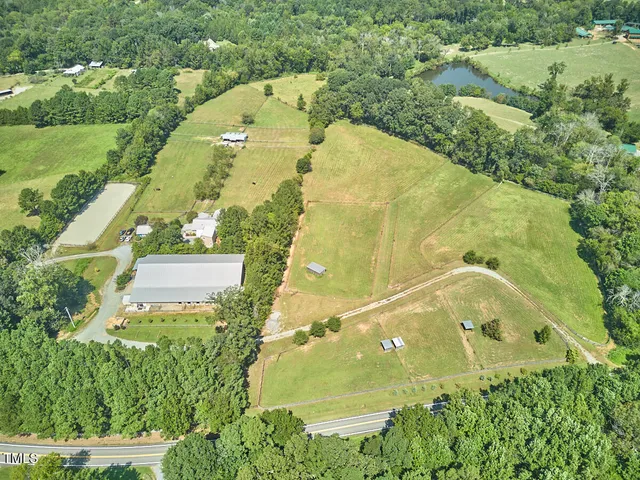 an aerial view of residential house with pool
