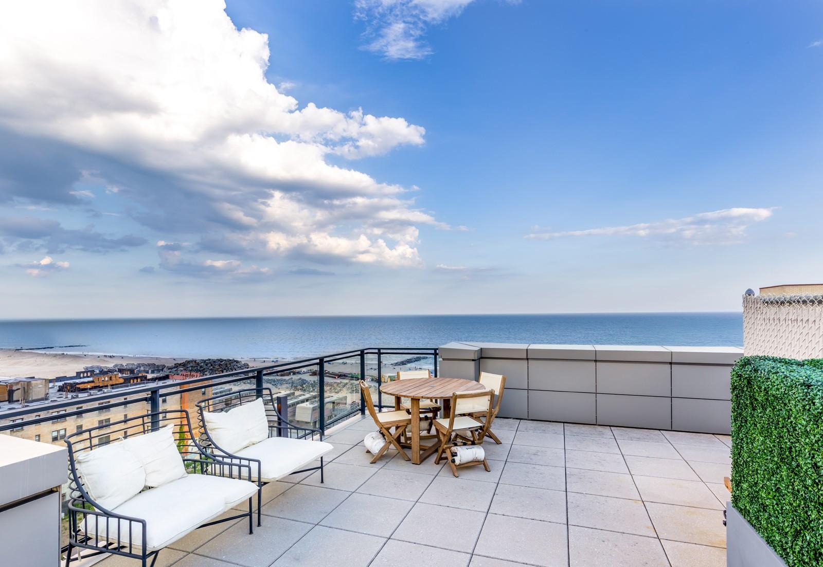 a view of a chairs and table in a patio