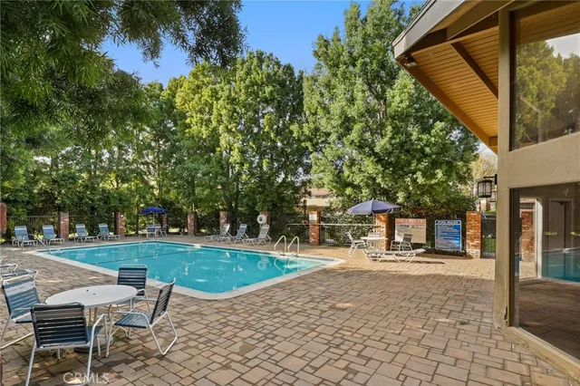 a view of a swimming pool with a patio