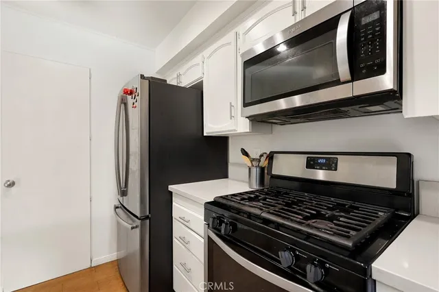 a kitchen with a stove and a microwave