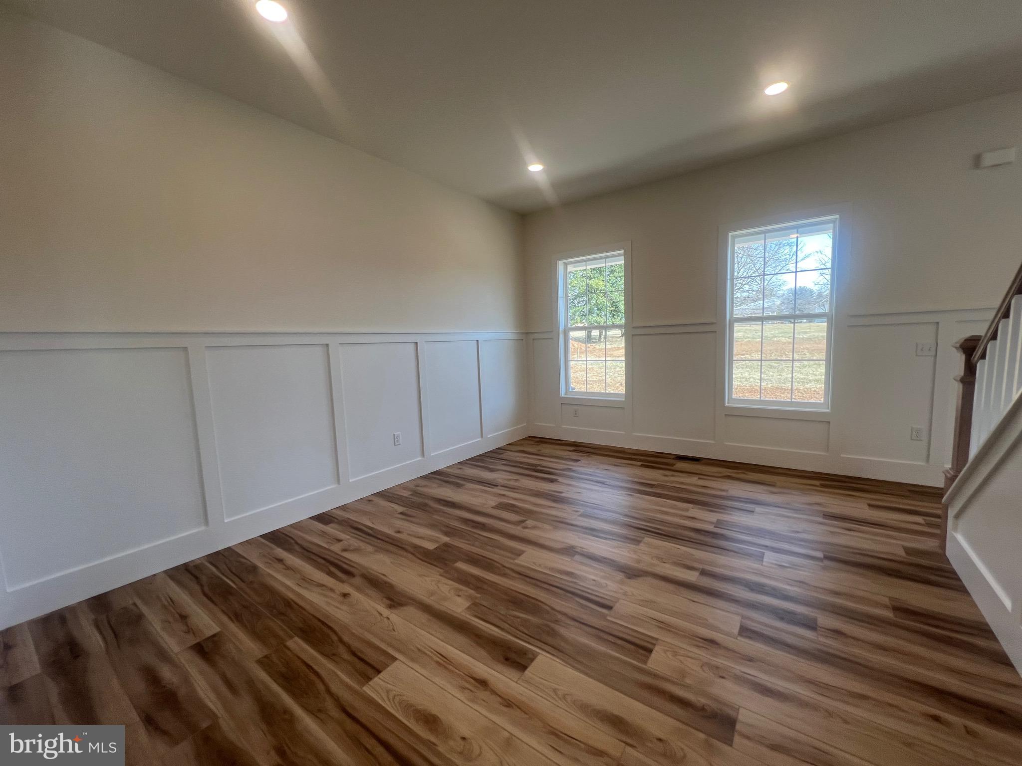 179 Ellicott Road Avondale, PA 19311 - Photo 18 of 65 an empty room with wooden floor and windows